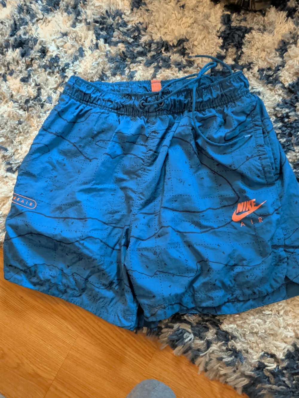 Nike Blue Athletic Shorts with Orange Accent